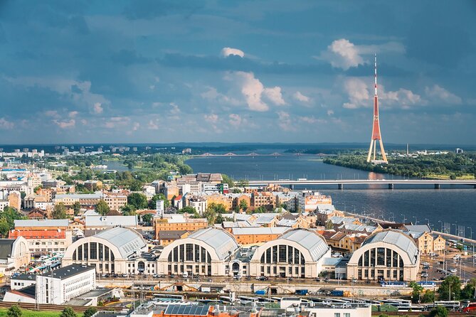 Fun Walk Private Tour Around Central Market Riga - Entering Riga Central Market through its giant halls