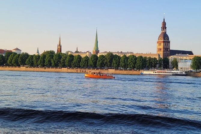 Riga: Evening or Sunset Boat Tour with Drink and Audio Guide - Sunset or night: choosing the right departure