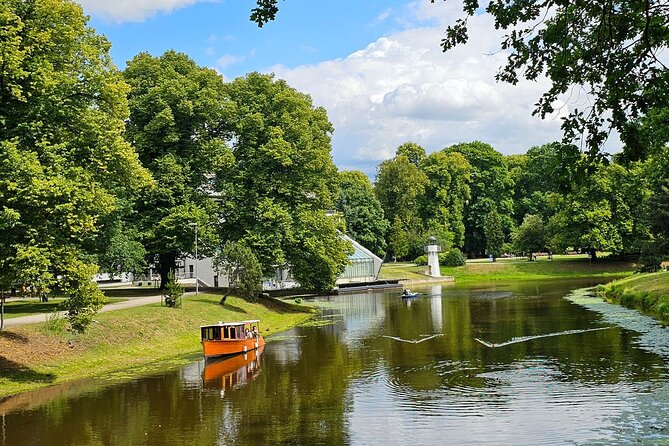 Riga: Evening or Sunset Boat Tour with Drink and Audio Guide - The welcome drink adds real value