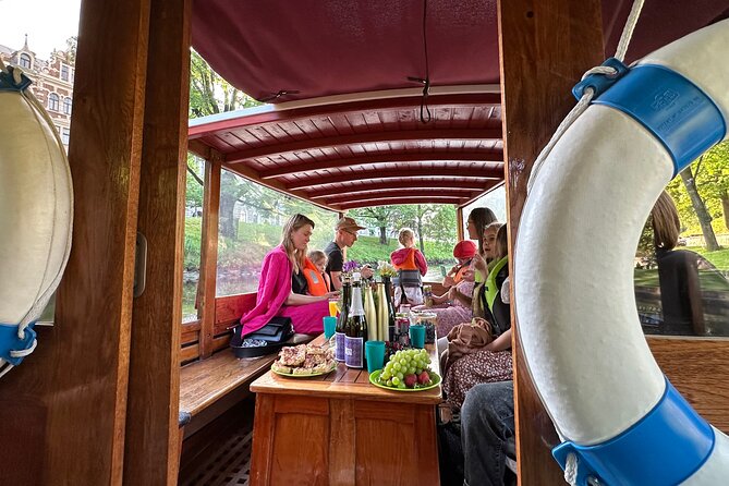 Riga: Evening or Sunset Boat Tour with Drink and Audio Guide - Starting at Andrejosta Yacht Club